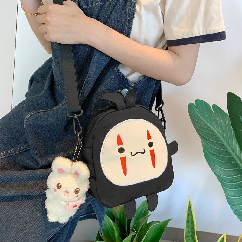 Cute Cartoon No Face Man Plush Bag Hayao Miyazaki Messenger Bag for Kids Adults - TIKIJTRONICS 0 SPECIFICATIONSWarning: -Recommend Age: 12+y,18+Origin: Mainland ChinaModel Number: faceless men's plush bagMaterial: PlushItem Type: Plush BackpacksGender: GirlsFeatures: Stuffed & PlushDimensions: About 19 x 20 x 7cmBrand Name: Sevrwell TIKIJTRONICS  (Store description)