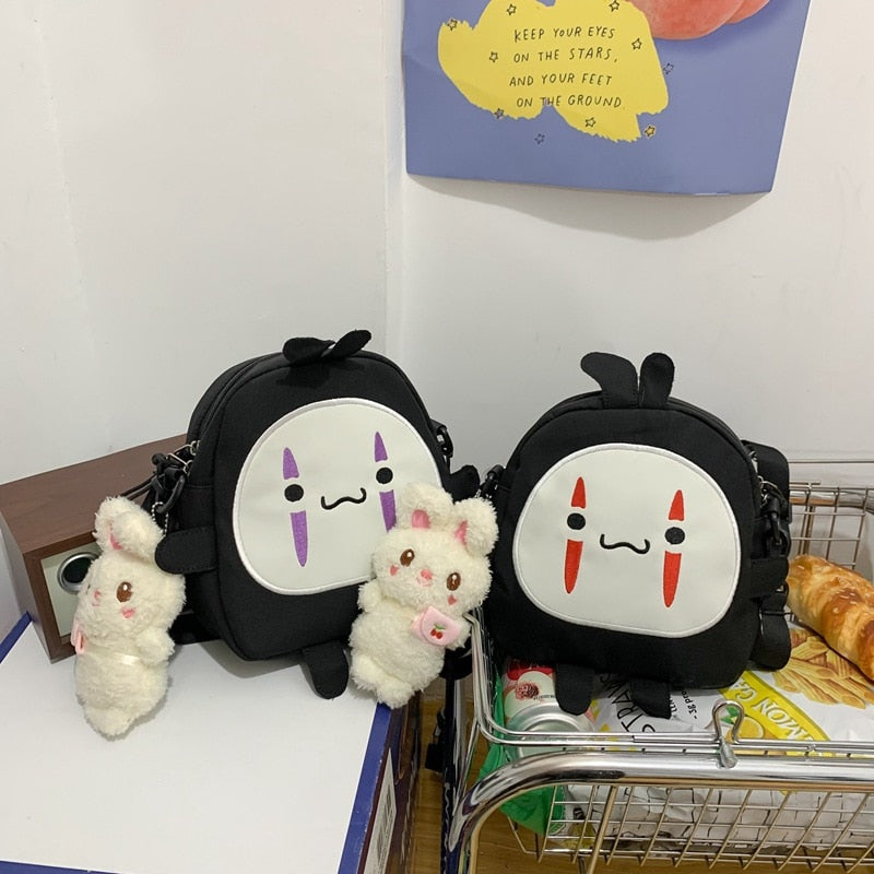 Cute Cartoon No Face Man Plush Bag Hayao Miyazaki Messenger Bag for Kids Adults - TIKIJTRONICS 0 SPECIFICATIONSWarning: -Recommend Age: 12+y,18+Origin: Mainland ChinaModel Number: faceless men's plush bagMaterial: PlushItem Type: Plush BackpacksGender: GirlsFeatures: Stuffed & PlushDimensions: About 19 x 20 x 7cmBrand Name: Sevrwell TIKIJTRONICS  (Store description)