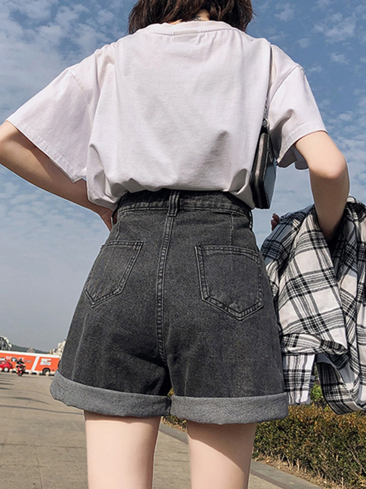 FTLZZ New Summer Women High Waist Button Wigh Leg Jeans Shorts Casual Female Loose Fit Blue Denim Shorts - TIKIJTRONICS 0 SPECIFICATIONSWaist Type: HIGHStyle: CasualPlace Of Origin: China (Mainland)Pattern Type: SolidPant Style: RegularOrigin: Mainland ChinaModel Number: R2042504Material Composition: denimMaterial: PolyesterItem Type: ShortsGender: WOMENFit Type: LOOSEFabric Type: DenimDecoration: ButtonClosure Type: Button FlyCN: GuangdongBrand Name: FTLZZ TIKIJTRONICS  (Store description)